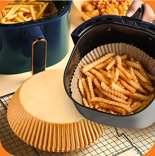 Air fryer with round parchment paper liner, ready for cooking.