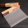 The roll of greaseproof paper is packaged inside the box.